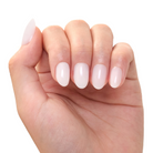 Hand with light pink nail polish on a white background